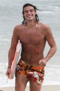 Andy Carroll and female friend frolic on the beach in Rio