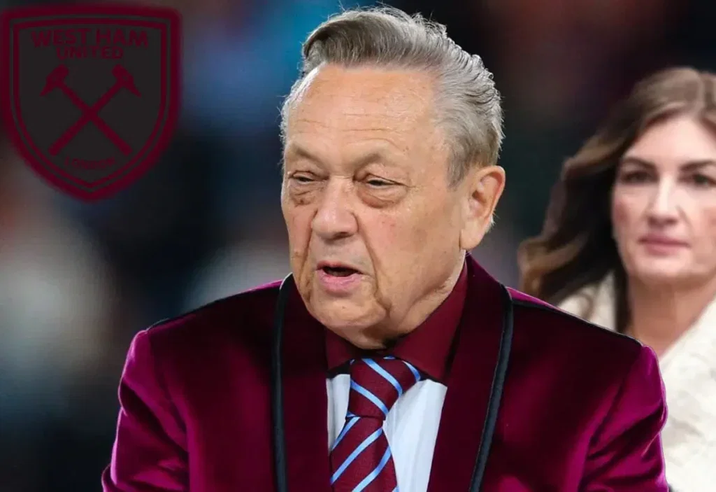David Sullivan walks in from of Karren Brady