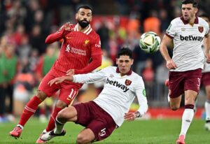 Alvarez fouls Liverpool's Mo Salah