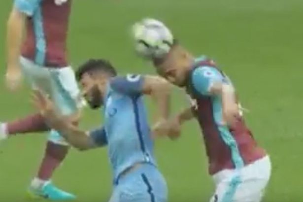 Sergio-Aguero-elbowing-Winston-Reid