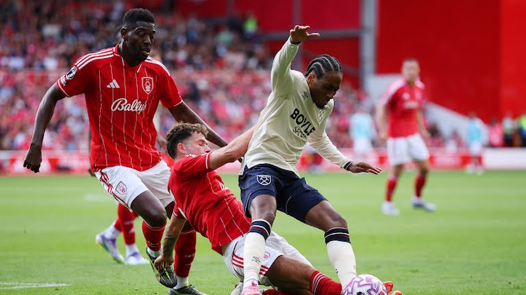 Kyle Walker Peters is tackled