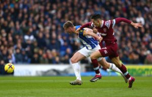 Evan Ferguson sprints past West Ham's Nayef Aguerd