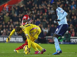 SOUTHAMPTON, ENGLAND - FEBRUARY 11: Adrian of West Ham handles the ball outside of the area as  Sadio Mane of Southampton challenges and subsequently receives a red card   during the Barclays Premier League match between Southampton and West Ham United at St Mary's Stadium on February 11, 2015 in Southampton, England.  (Photo by Michael Steele/Getty Images)