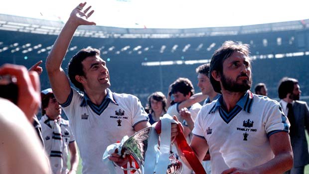 Football. F.A.Cup Final. 10th May 1980. Wembley Stadium, London. West Ham United 1 v Arsenal 0. West Ham United goalscorer, Trevor Brooking (left) celebrating with team-mate Frank Lampard as they parade the trophy.