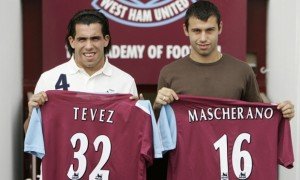 LONDON, United Kingdom:  Argentinian footballer's Carlos Tevez (L) and Javier Mascherano pose with their new West Ham United Club shirts at a photocall at Upton Park, in east London, 05 September 2006. Striker Tevez and midfielder Mascherano, both aged 22, featured for Argentina at the World Cup finals and their move to Upton Park came on the final day of the transfer window. AFP PHOTO / SHAUN CURRY  (Photo credit should read SHAUN CURRY/AFP/Getty Images)